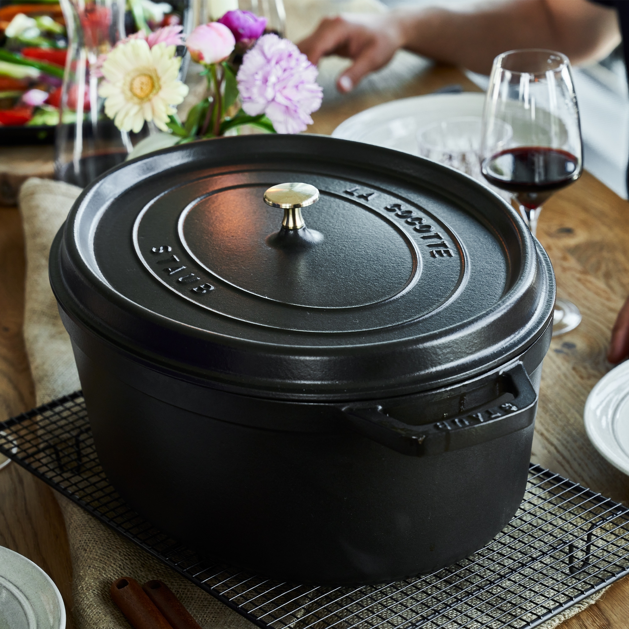 Cast iron Dutch oven La Cocotte with lid on table