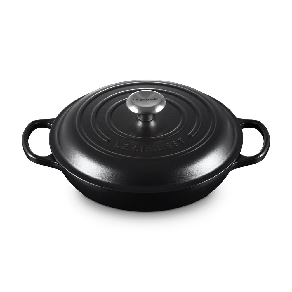 Black round Le Creuset cast iron casserole with lid