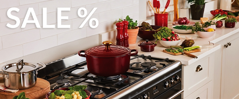 Red casserole and pots in kitchenware sale