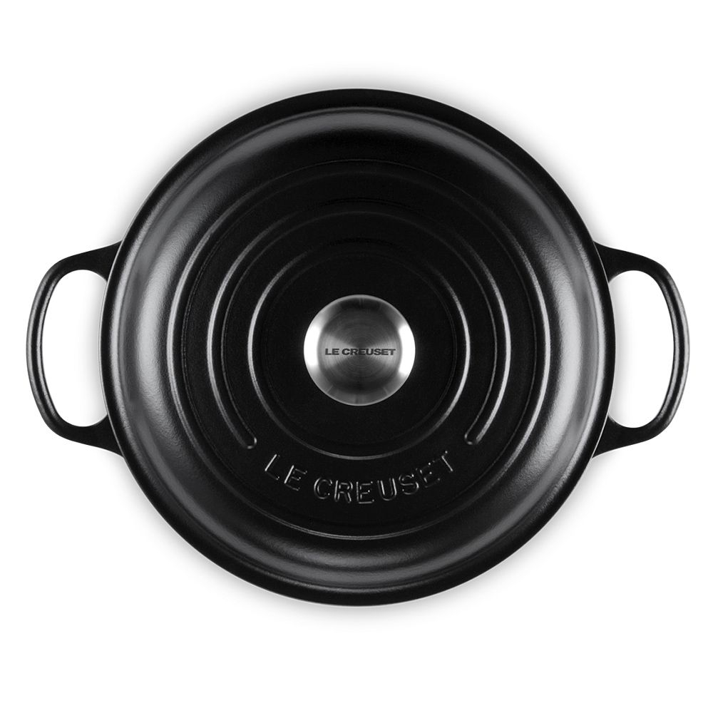 Black round Le Creuset casserole with lid