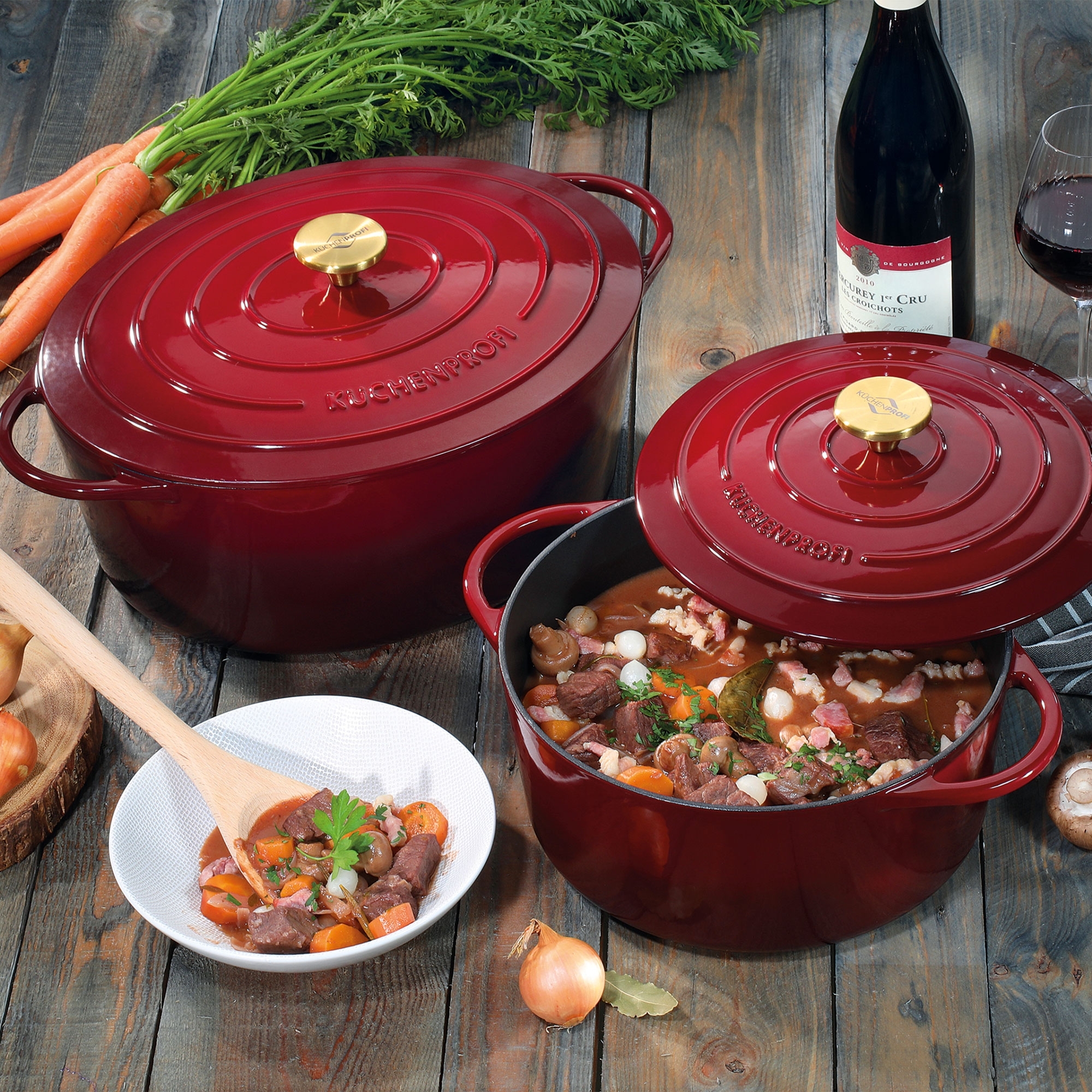 Red cast iron casserole with beef stew